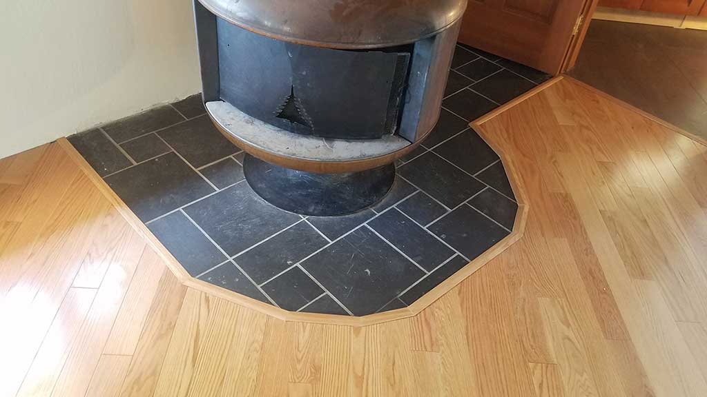 Hardwood Flooring Angles Around a Fireplace in a Los Gatos Home